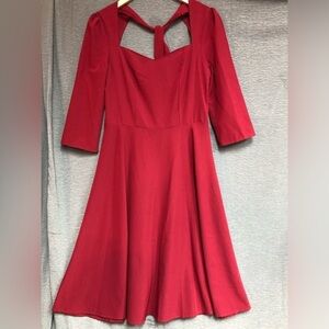 Medium red dress with sweetheart, neckline and tie back at neck